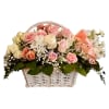 A soft mix of pink and cream roses arranged in a white