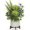 Gorgeous green blooms and a mod, mid-century ceramic planter add up to