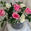 Beautiful pink and white roses with a touch of babies breath and