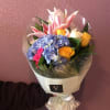 Our designer choice of fresh flowers in the hand-hold style bouquet. A