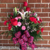 A variety of romantic flowers in the love colors of reds, pinks
