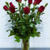 Celebrate love and elegance with 12 long-stem red roses, artfully arranged in