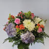 A fun colorful arrangement that will bring joy to all. 
