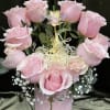 Cute pink container with roses in the shape of a heart with