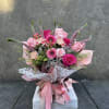 wrapped bouquet, with a mix of pink and hot pink roses, Gerber