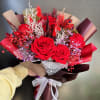 6 red preserved roses mixed with red and purple preserved baby's breath
