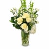 A classic, subtle tribute vase of white blooms accented with tasteful greens