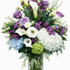 A gorgeous array of lavender, green and white blooms designed in a