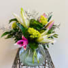 A fresh mix of Oriental lilies, mini green hydrangea and purple Mardi