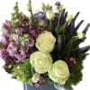 A gorgeous arrangement of lavenders, creams and pale blues. Designed in chic