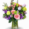 A beautiful softer arrangement of light greens, pinks and lavenders.  We