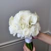 It's a round, elegant bridal bouquet made of roses with a few