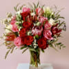 Combo of premium roses and florals with prominent protea a Stella Grey