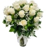 White roses in a vase with greenery and baby's breath.
Standard: One Dozen