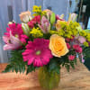 A mixed blend of flowers and colors, the sweet sentiments bouquet is