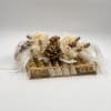 A luxurious chocolate arrangement designed in soft ivory and gold tones, featuring
