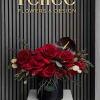 A bold and modern floral arrangement featuring premium red roses accented with
