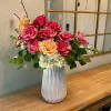 Faith Hope and Lovely consists of large seasonal roses, white hydrangea, chrysanthemums