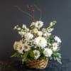 The Legacy Basket is a graceful sympathy arrangement designed to honor a