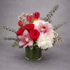 A timeless expression of love, featuring lush red roses, soft pink orchids