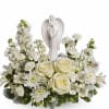 As serene as gentle falling snow, this pure white arrangement of roses