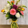 A beautiful traditional mixed arrangement including lilies, chrysanthemums, roses and other flowers