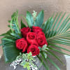 Six beautiful red roses with tropical forges and a black cheetah ribbon