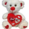 Delightful 9" White teddy bear holding a red love you heart. Super