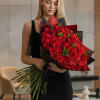 A grand and timeless bouquet featuring 50 rich red roses, beautifully arranged