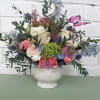 a lovely mixture of flowers including roses and a variety of fillers
