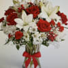 BOUQUET OF LILIES, ROSES, MINI CARNATIONS, ALSTROMERIA WITH GREENS IN A RED
