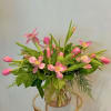This fresh tulip vase arrangement features soft pink tulips paired with lush