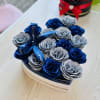 A stunning collection of glittering blue and silver roses, artfully arranged to