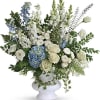 Beautiful arrangement for a sympathy service, with soft colors which are light