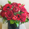 Beautiful bedside all red arrangement. Leaf-wrapped glass vase may be substituted based