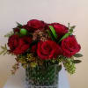One dozen pave style roses in a cube vase. Multiple different color