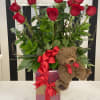 One dozen long stem roses,
box of Chocolates and Coco Bear