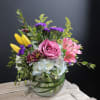 This a lively colorful arrangement with a variety of spring flowers like