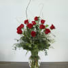 The classic red rose arrangement for romantic occasions, with a twist! In