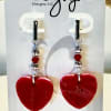 Handcrafted locally, these red clay heart earrings are a timeless expression of