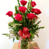 Dozen red Ecuadorian roses with greenery