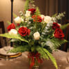 Celebrate with this red and white rose bouquet.  Accented with baby
