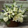 An expression of sympathy and love; this natural basket arrangement gives a