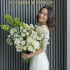 A timeless and elegant white flower bouquet designed to express purity, love