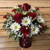 This red heart lantern container comes with coordinating roses, carnations, daisies, mini