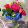 This bright and cheerful bouquet is bound to make anyone smile, blue