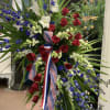 Beautiful tribute spray in Red, White, and Blue flowers. Perfect for military