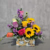 Bee Happy is a cheerful and vibrant floral arrangement designed to bring