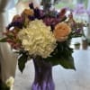 BEAUTIFUL BOUQUET OF HYDRANGEA, ROSES, DELPHINIUM, STATICE, MUMS, AND ALSTROMERIA IN A