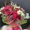 A beautifully handcrafted bouquet of mixed-color spray roses, perfect for expressing love